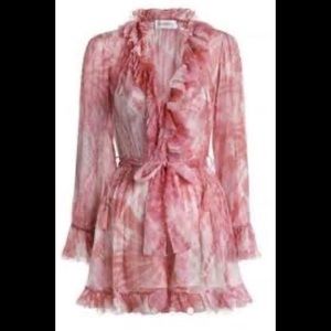 Pink and cream ruffle Romper with buttons and belt.